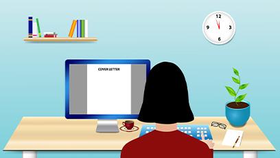 The woman is sitting at a desk and writes the cover letter on PC monitor in front of her