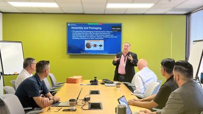 Rick Vaughn presents a semiconductor lesson to students