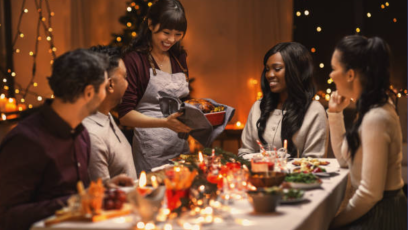 A group of friends celebrate the holidays over dinner