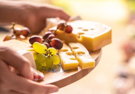 Cheese and grapes on a charcuterie board