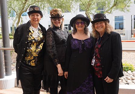 emplpoyees dressed up in steampunk costumes for college wide day