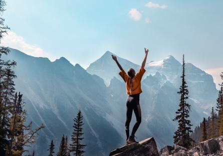 Woman exercising in front of a mountain