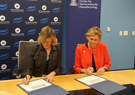 Kate smith and Liesel Folks signing the MOU