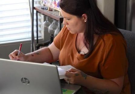 photo of Rio Salado College student Brittany Gray studying with a laptop and notebook photo of Rio Salado College student Brittany Gray studying with a laptop and notebook