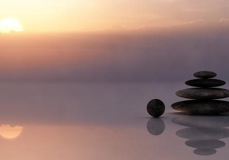 Meditative image of a stack of stones by the sea