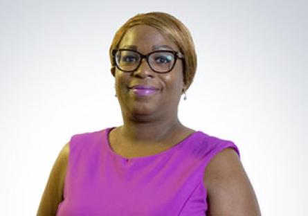 headshot of Kesha Shelton in a purple top in front of a white background