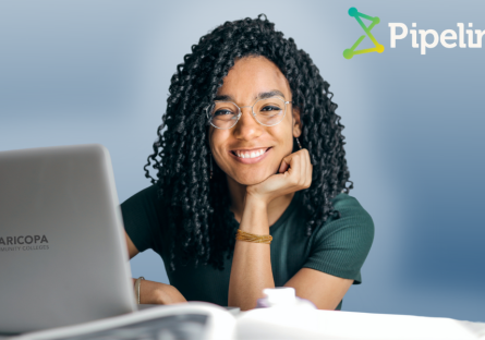 photo of a woman in front of a laptop