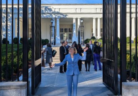 President Kate Smith at the gates in the front of the White House