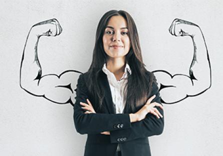 Portrait of attractive young businesswoman with drawn muscly arms. Confidence and strength concept