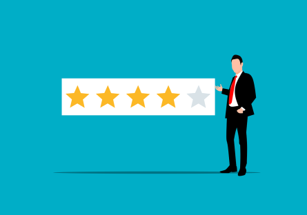 Man standing next to a four star rating