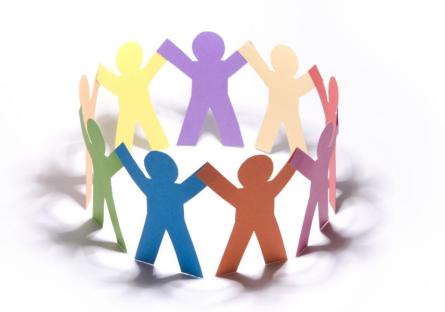 A circle of multi-colored paper dolls holding hands