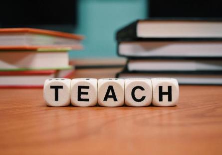 A set of blocks spelling out the word TEACH